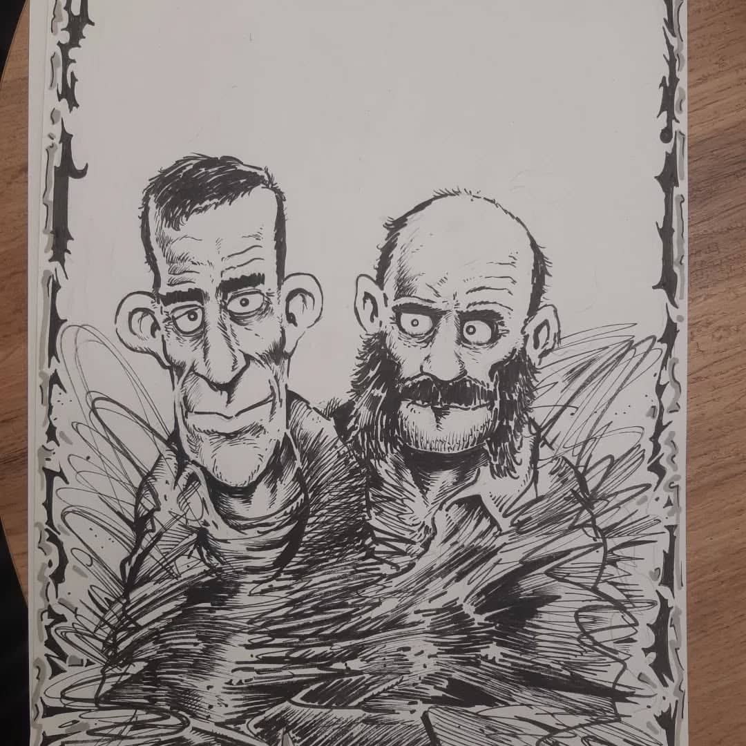 Deux visages grotesques à l'encre